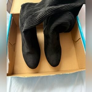 Thought high black boots easy to get on brand new with the box